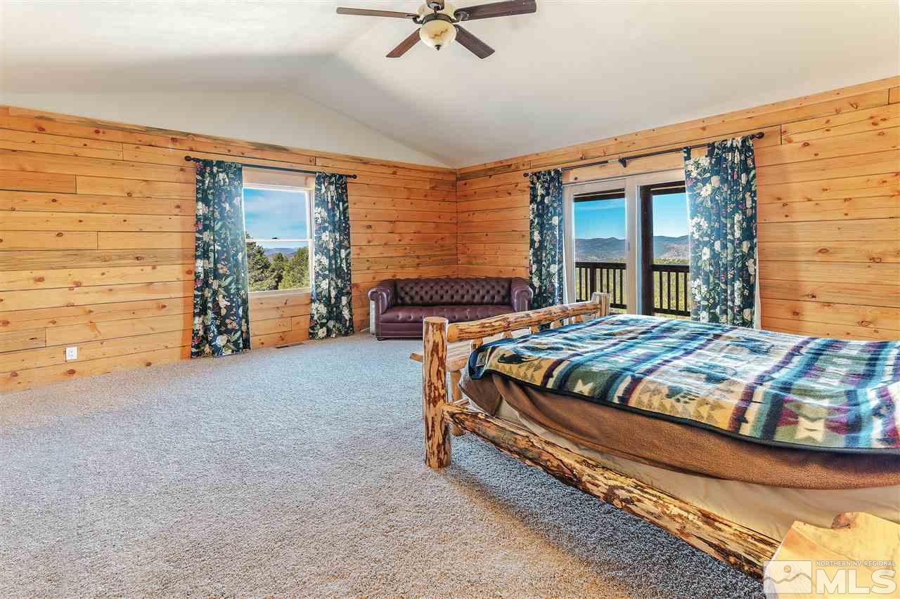 4820 Livery Road Reno, NV 89521 - Photo 14 of 25 a bedroom with a bed and ceiling fan