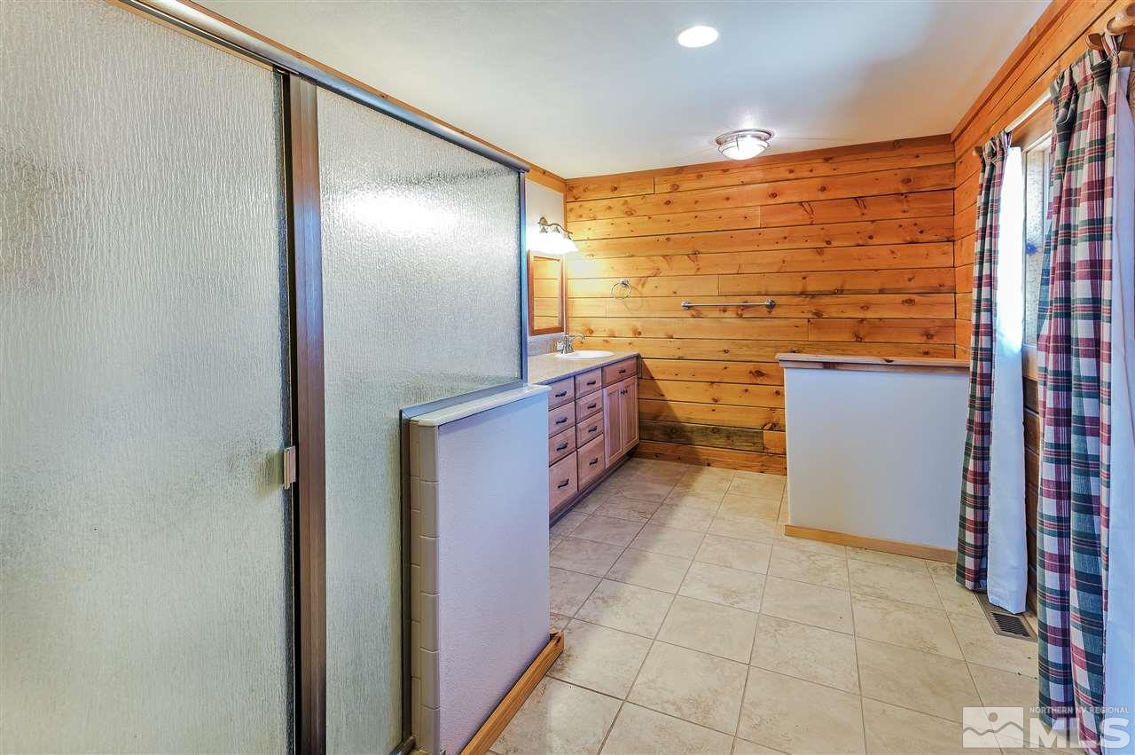 4820 Livery Road Reno, NV 89521 - Photo 15 of 25 a bathroom with a shower and a sink