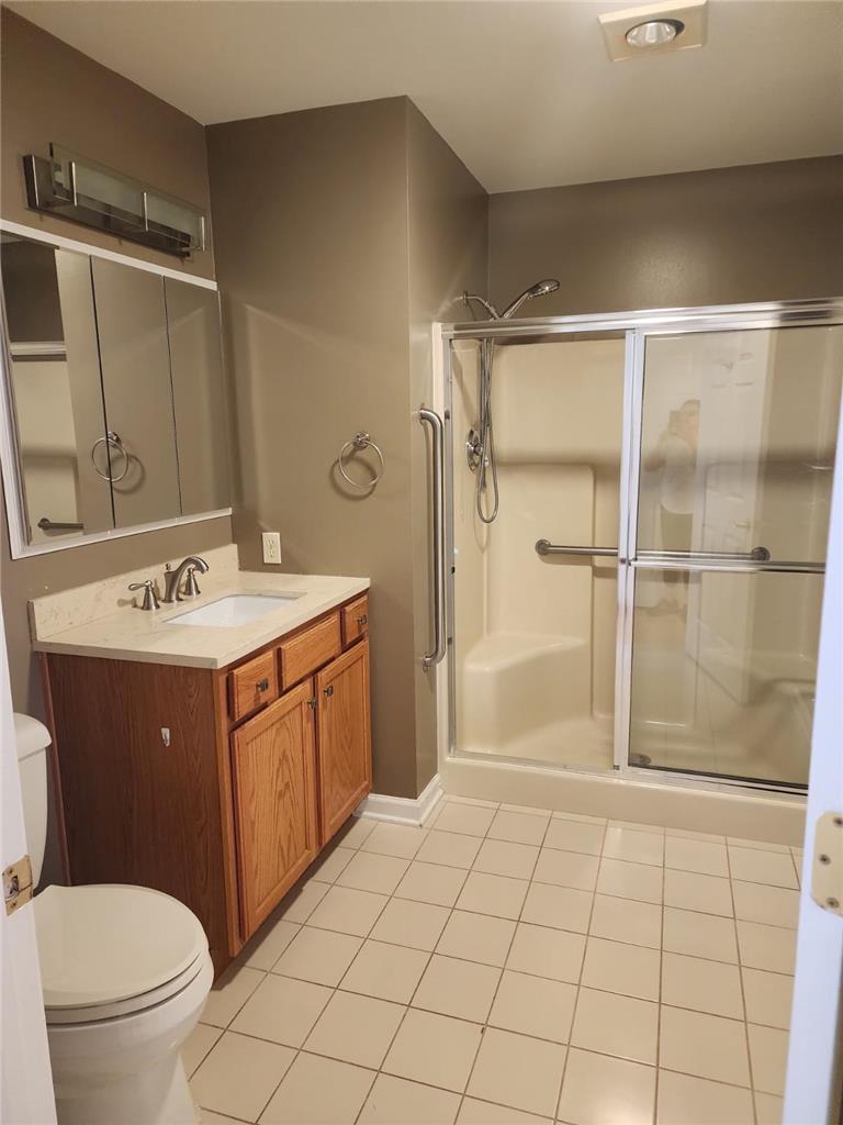 2740 Upstream Farm Road Easton, PA 18040 - Photo 10 of 13 A well-appointed bathroom features a single vanity and a convenient glass-enclosed shower stall.