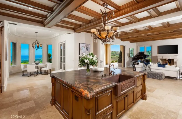 a living room with stainless steel appliances granite countertop lots of counter top space