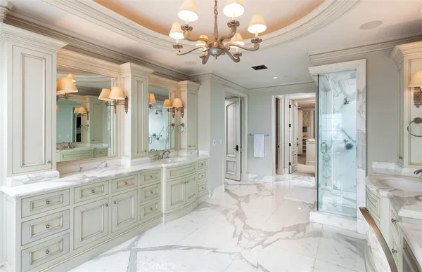 a large bathroom with a granite countertop sink mirror and shower