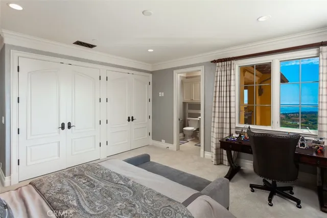a bathroom with a granite countertop toilet a sink and a mirror