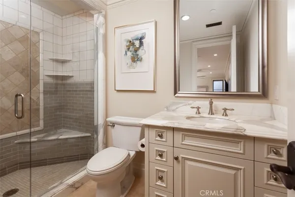 a bedroom with a bed and ceiling fan