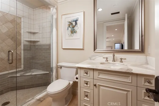 a bedroom with a bed and ceiling fan