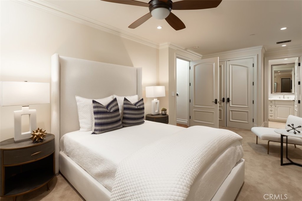 1 Shell Beach Newport Coast, CA 92657 - Photo 33 of 46 a bedroom with a bed and ceiling fan