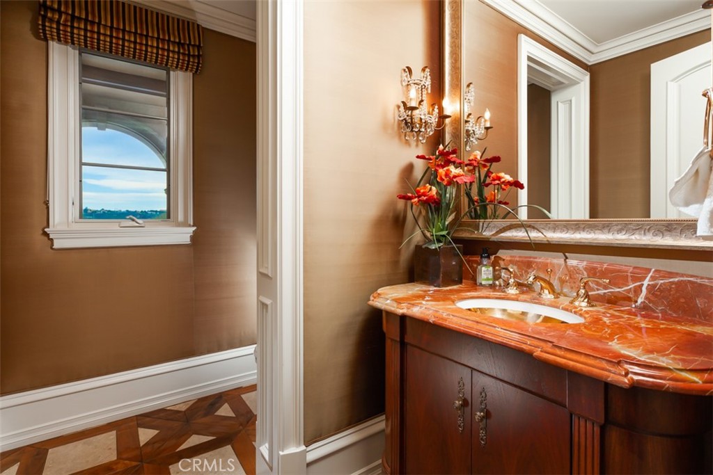 1 Shell Beach Newport Coast, CA 92657 - Photo 40 of 46 a bathroom with a sink and a mirror