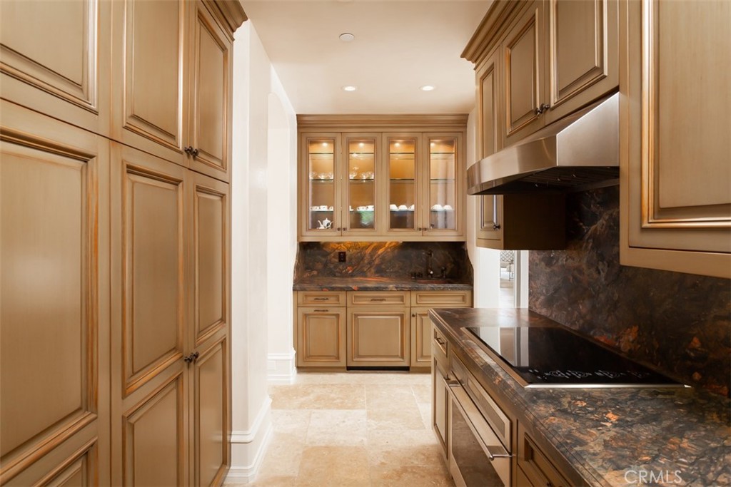 1 Shell Beach Newport Coast, CA 92657 - Photo 41 of 46 a kitchen with stainless steel appliances granite countertop a stove a sink and a microwave