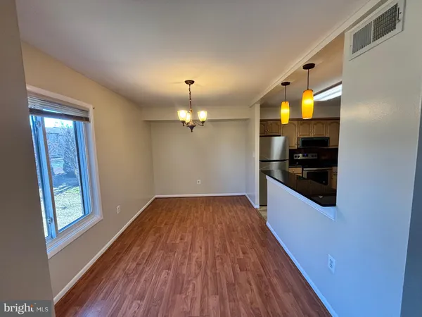 a view of a kitchen from the hallway