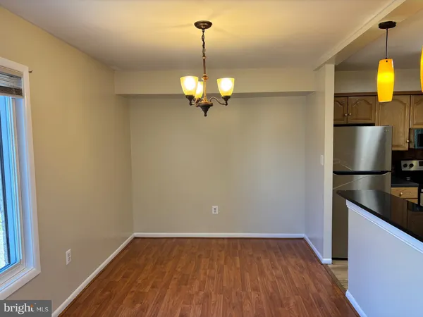 a view of a kitchen from a ceiling fan