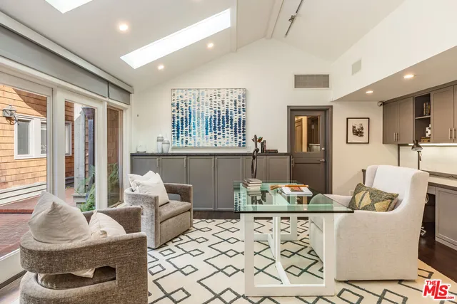 a living room with furniture fireplace and flat screen tv