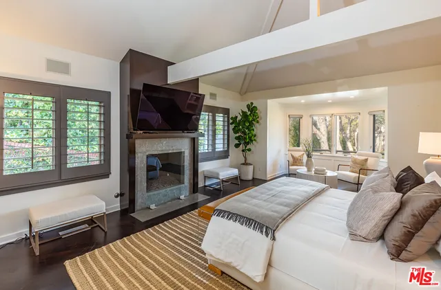 a view of balcony with couch and chairs