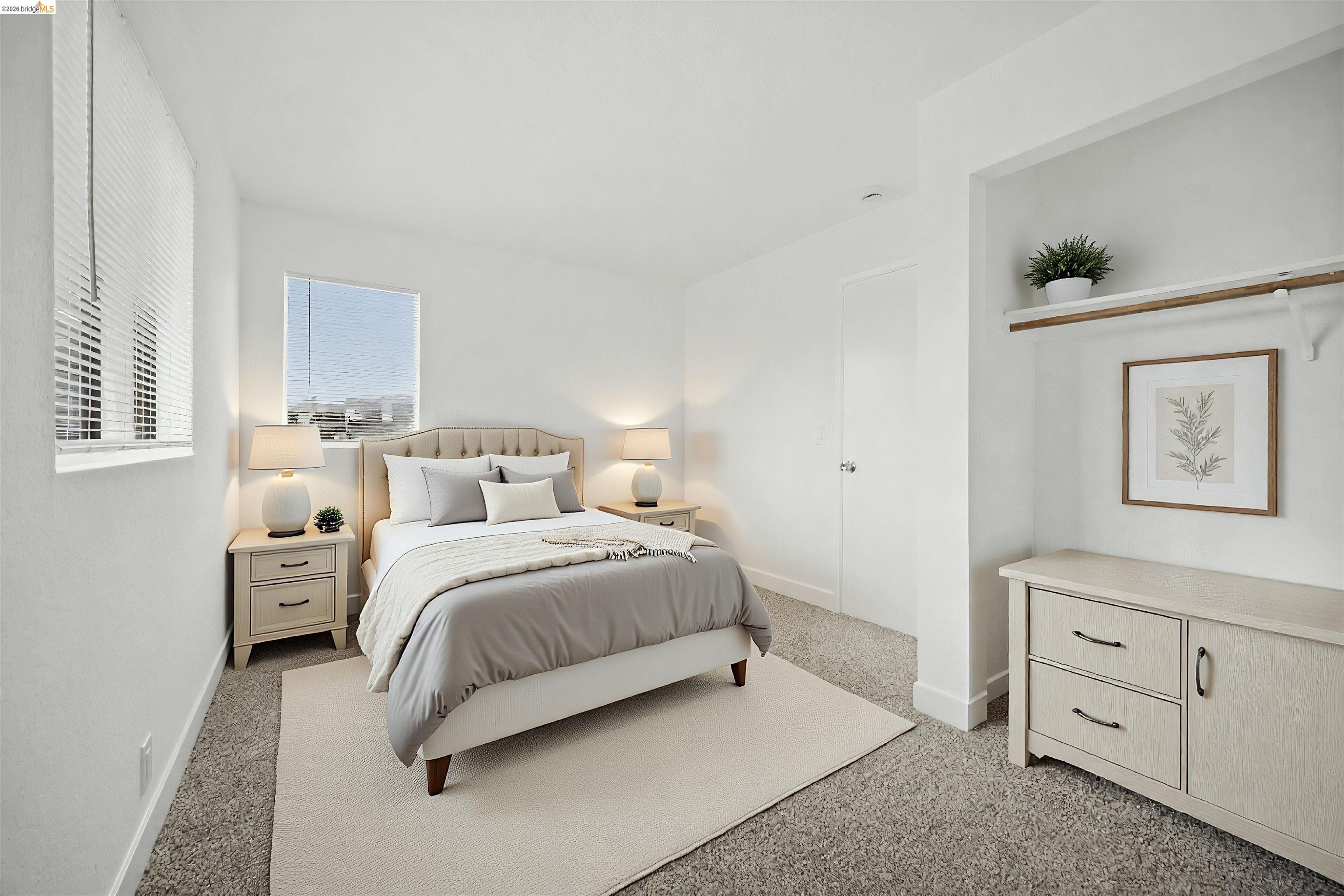 10933 Julius Street, Unit D Oakland, CA 94605 - Photo 15 of 28 a spacious bedroom with a bed and window