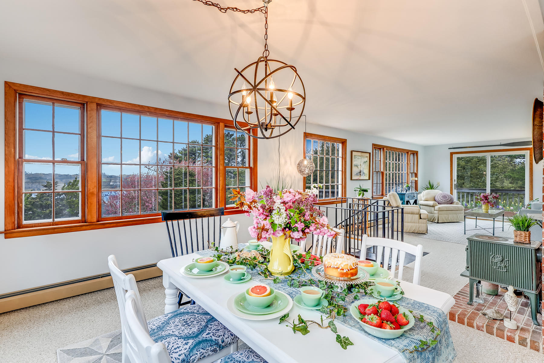 22 Ruggles Road Orleans, MA 02653 - Photo 16 of 38 a dining room with furniture a chandelier and a rug