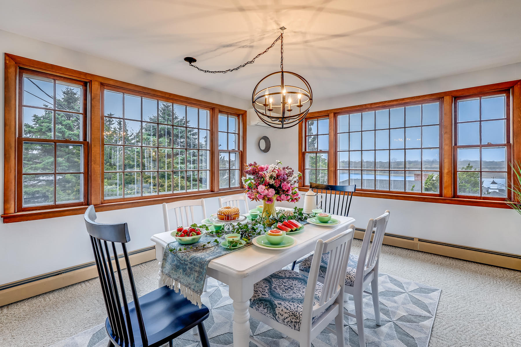 22 Ruggles Road Orleans, MA 02653 - Photo 18 of 38 a view of a dining room with furniture window and chandelier