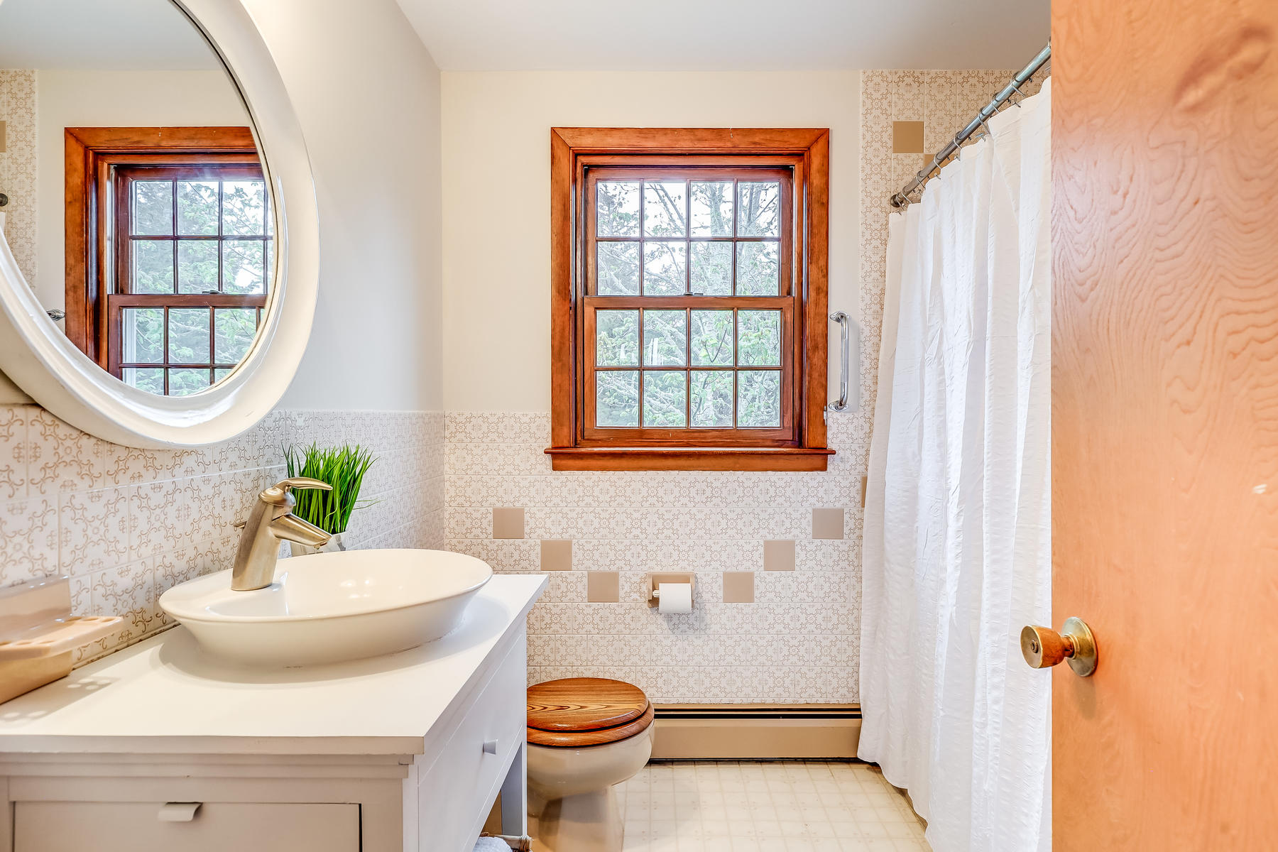 22 Ruggles Road Orleans, MA 02653 - Photo 21 of 38 a bathroom with a sink and a mirror