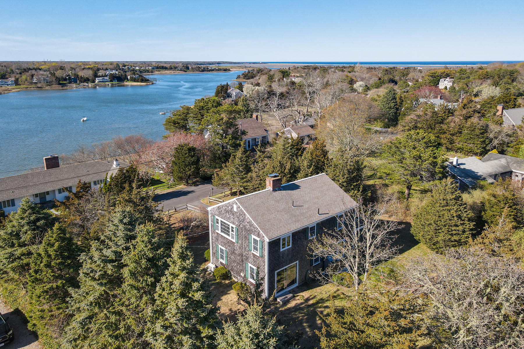 22 Ruggles Road Orleans, MA 02653 - Photo 31 of 38 an aerial view of a house with a yard and lake view