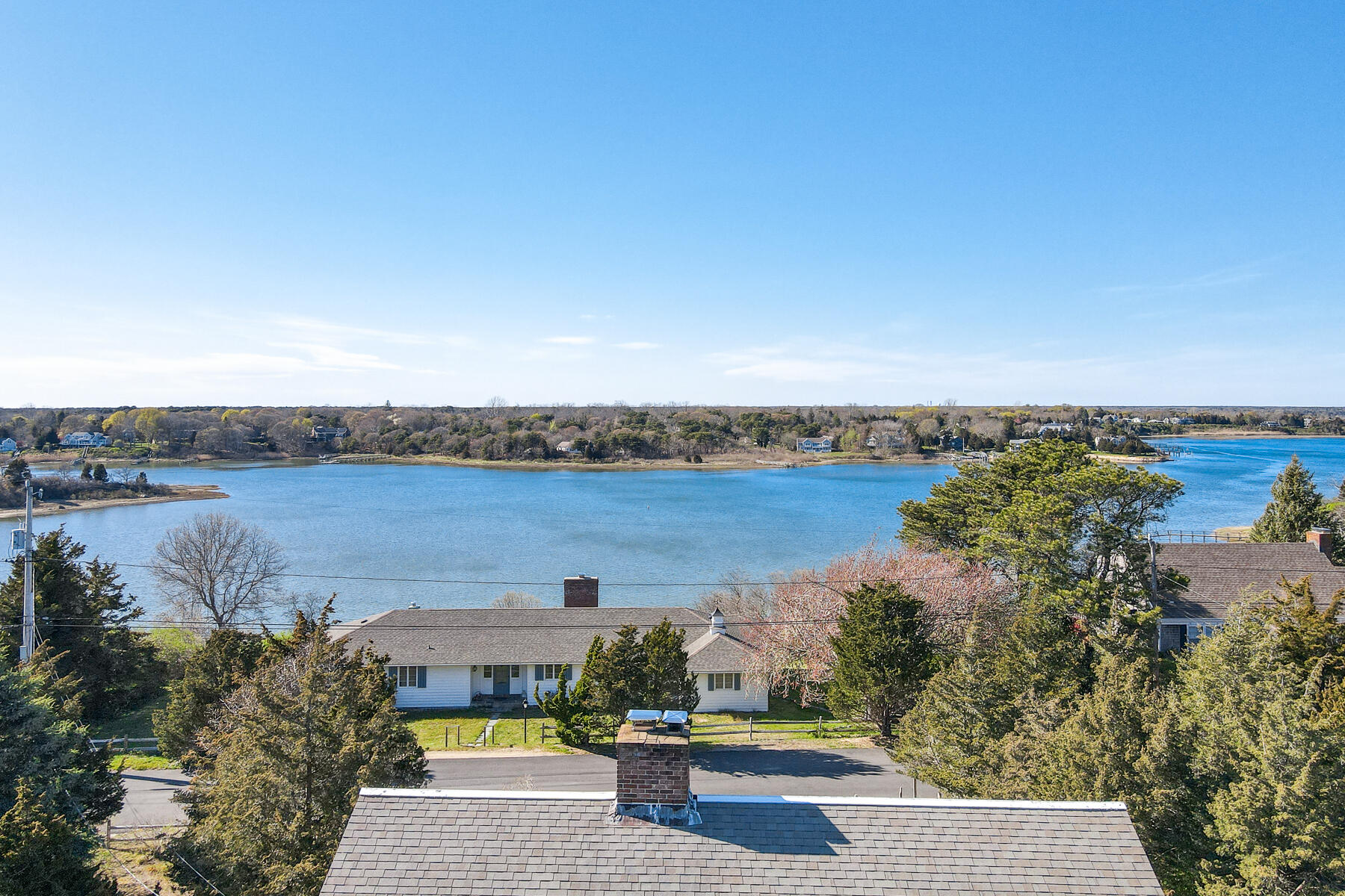 22 Ruggles Road Orleans, MA 02653 - Photo 5 of 38 an aerial view of a house with a garden and lake view