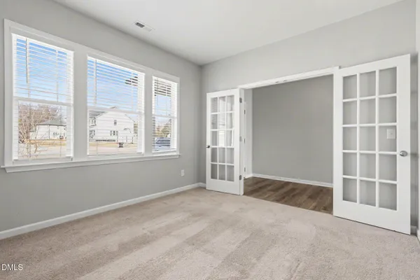 a view of an empty room with a window