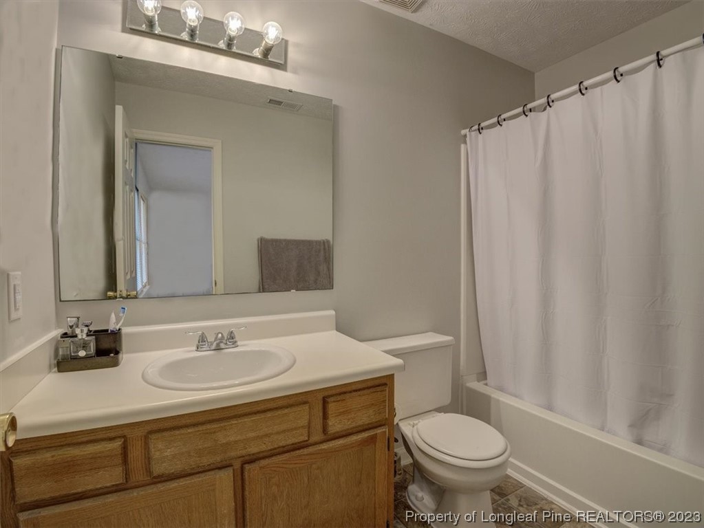433 Wapiti Drive Spring Lake, NC 28390 - Photo 21 of 31 a bathroom with a sink toilet and shower