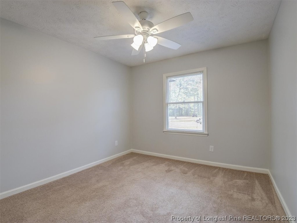 433 Wapiti Drive Spring Lake, NC 28390 - Photo 25 of 31 an empty room with windows and fan