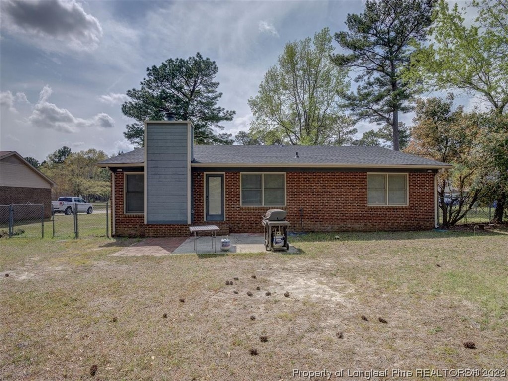 433 Wapiti Drive Spring Lake, NC 28390 - Photo 29 of 31 a front view of a house with garden