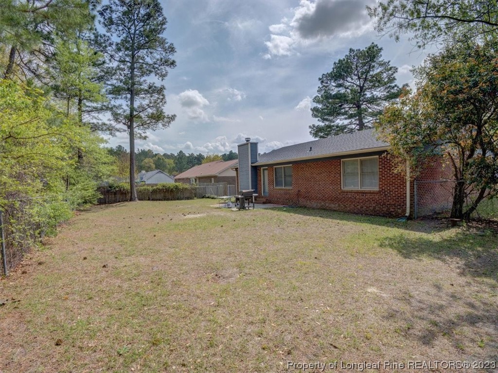 433 Wapiti Drive Spring Lake, NC 28390 - Photo 30 of 31 a backyard of a house with lots of green space
