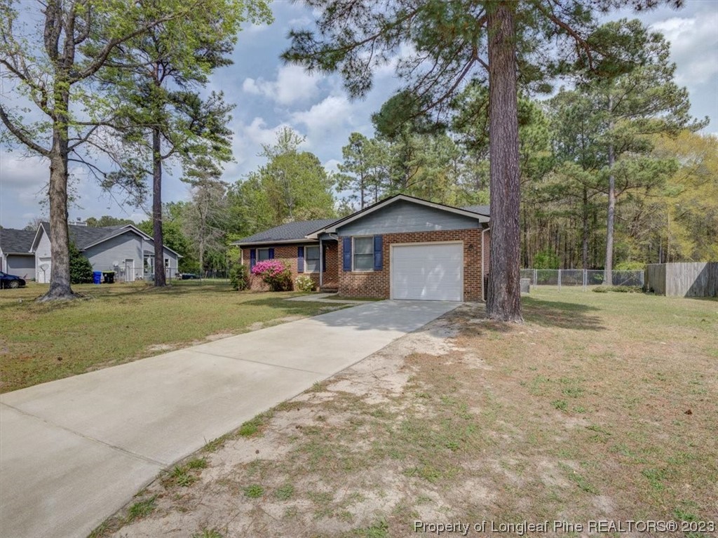 433 Wapiti Drive Spring Lake, NC 28390 - Photo 3 of 31 a house with trees in the background