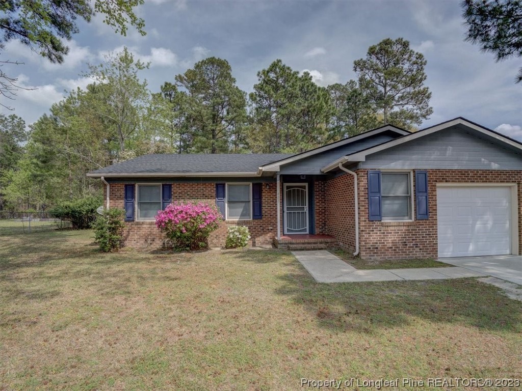 433 Wapiti Drive Spring Lake, NC 28390 - Photo 4 of 31 front view of a house with a yard