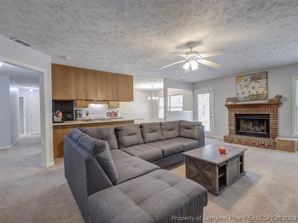 433 Wapiti Drive Spring Lake, NC 28390 - Photo 8 of 31 a living room with furniture and a fireplace