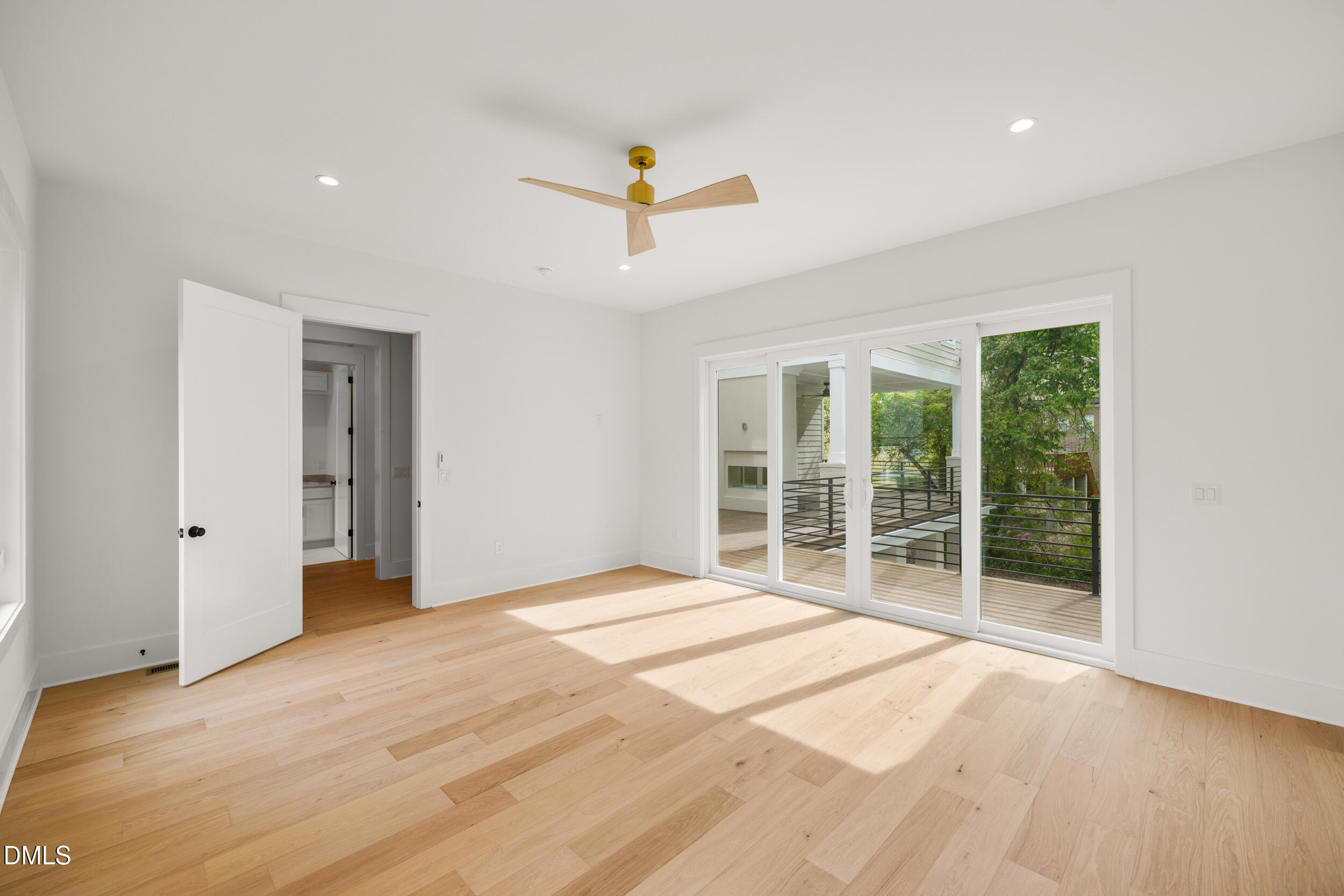 2817 Claremont Road Raleigh, NC 27608 - Photo 31 of 73 a view of empty room with wooden floor and fan