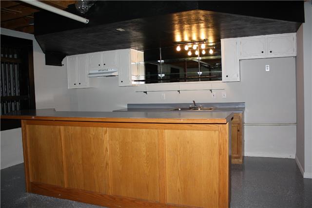 400 Fairway Trail Springfield, TN 37172 - Photo 16 of 20 Also, there's this full kitchen in the basement! Enough room for a full sized refrigerator too. Right beside this is a storm shelter perfect for someone with claustrophobia because it has bars instead of being completely sealed off!
