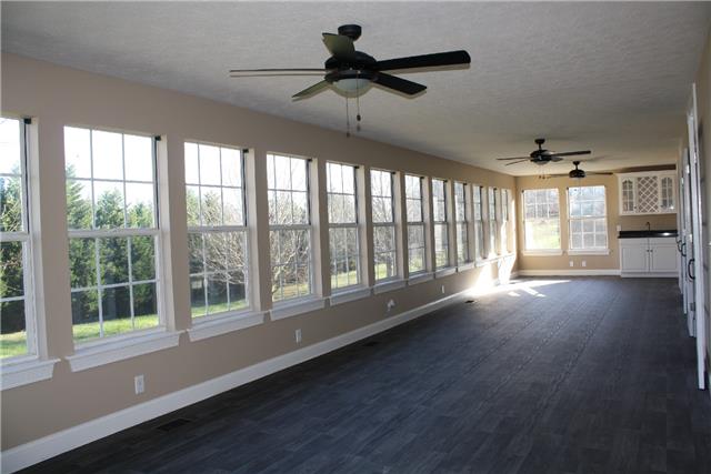 400 Fairway Trail Springfield, TN 37172 - Photo 8 of 20 This room is amazing!!! It has three doors leading from the living room and kitchen and is a whopping 44 ft. long! With 13 windows across and two on each end, this room is flooded with light! At the far end is a bar for entertaining!