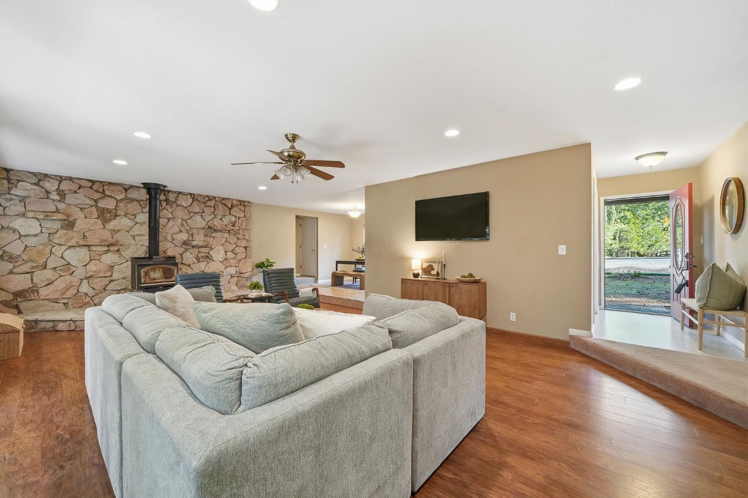 a living room with furniture and a flat screen tv