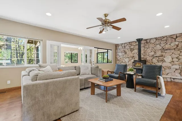 a living room with furniture and a large window