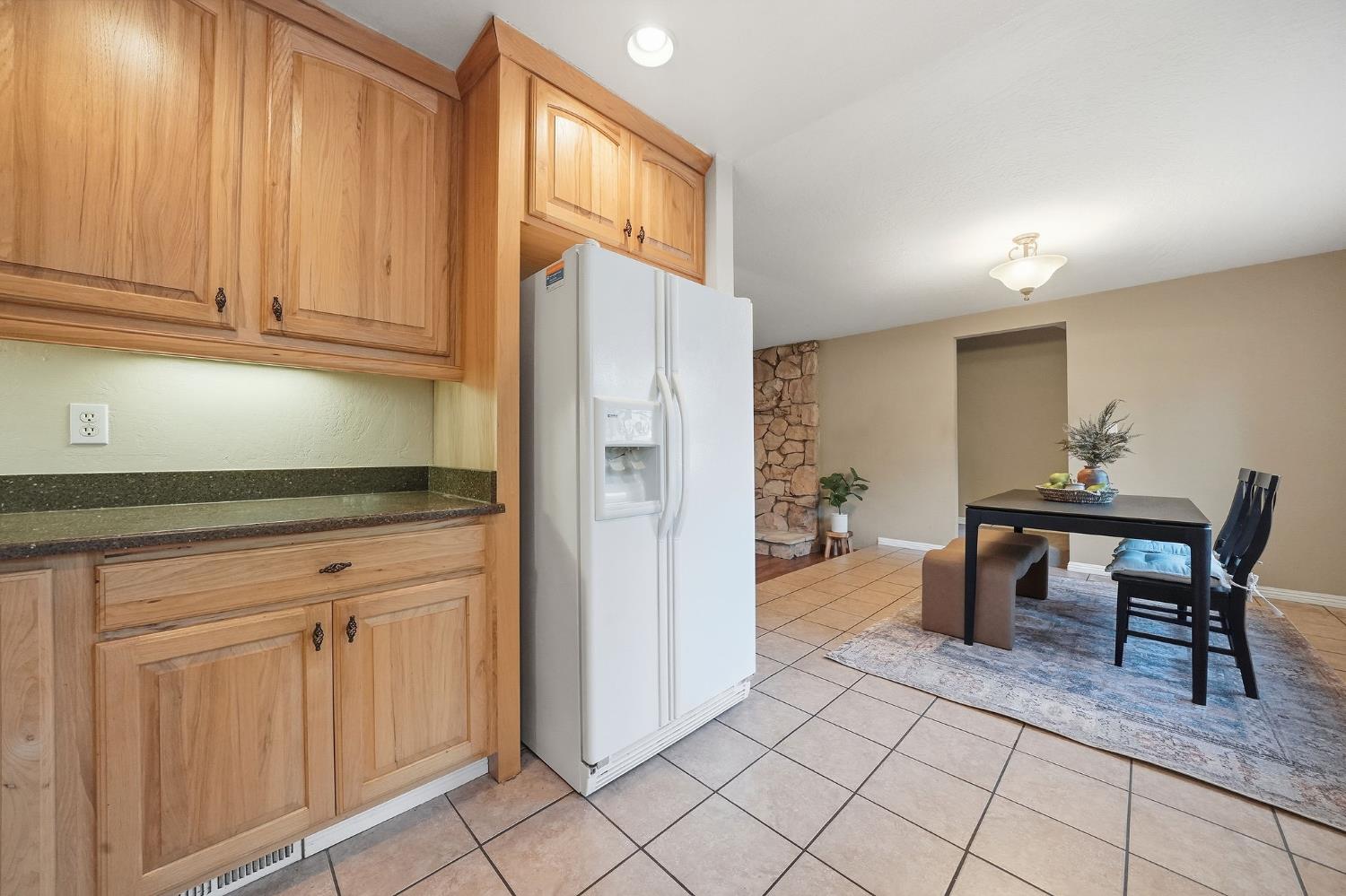 26019 Ridge Drive Pioneer, CA 95666 - Photo 22 of 75 a kitchen with cabinets and chairs