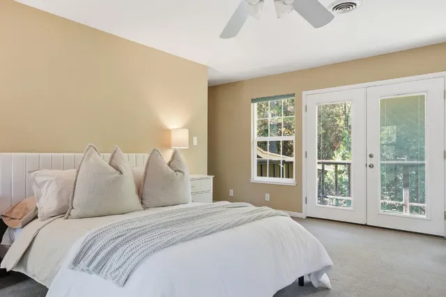 a bathroom with a double vanity sink toilet and a mirror