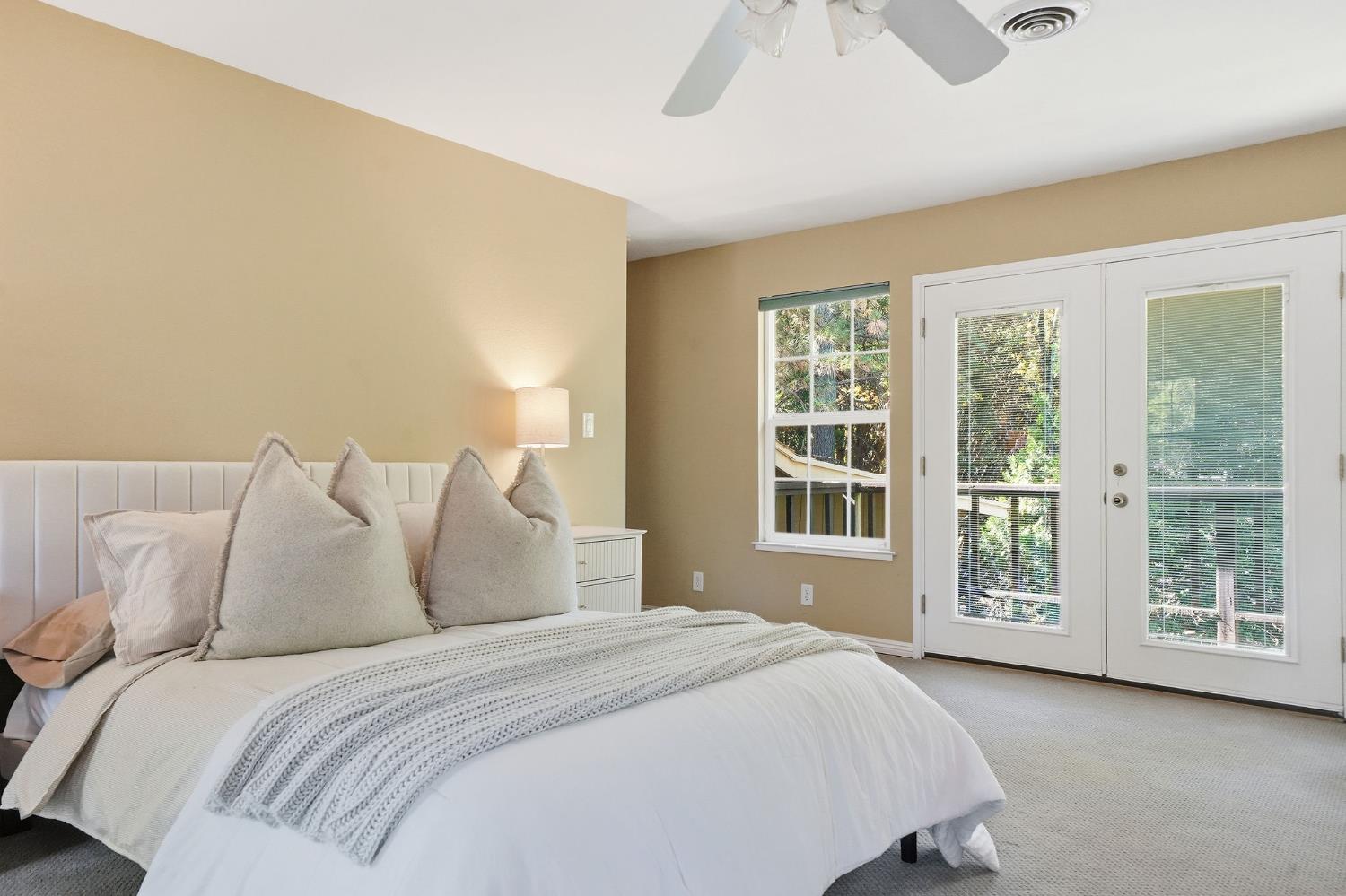 26019 Ridge Drive Pioneer, CA 95666 - Photo 25 of 75 a bedroom with a large bed and a large window