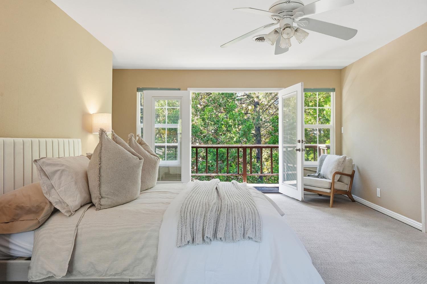 26019 Ridge Drive Pioneer, CA 95666 - Photo 31 of 75 a bedroom with a bed and large windows