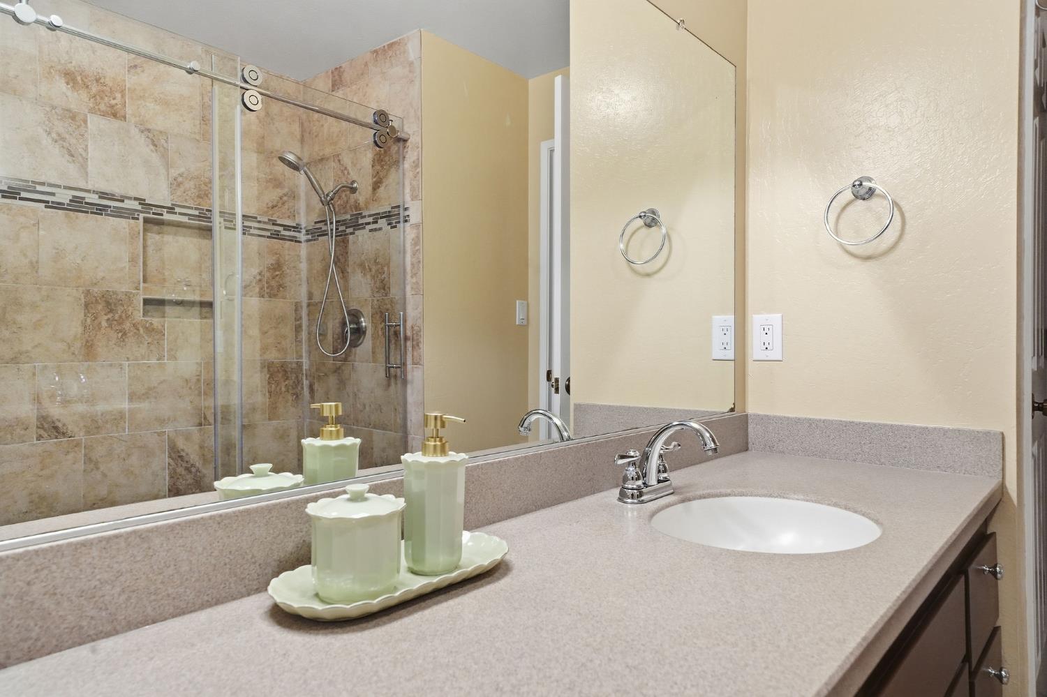 26019 Ridge Drive Pioneer, CA 95666 - Photo 44 of 75 a bathroom with a double vanity sink and mirror
