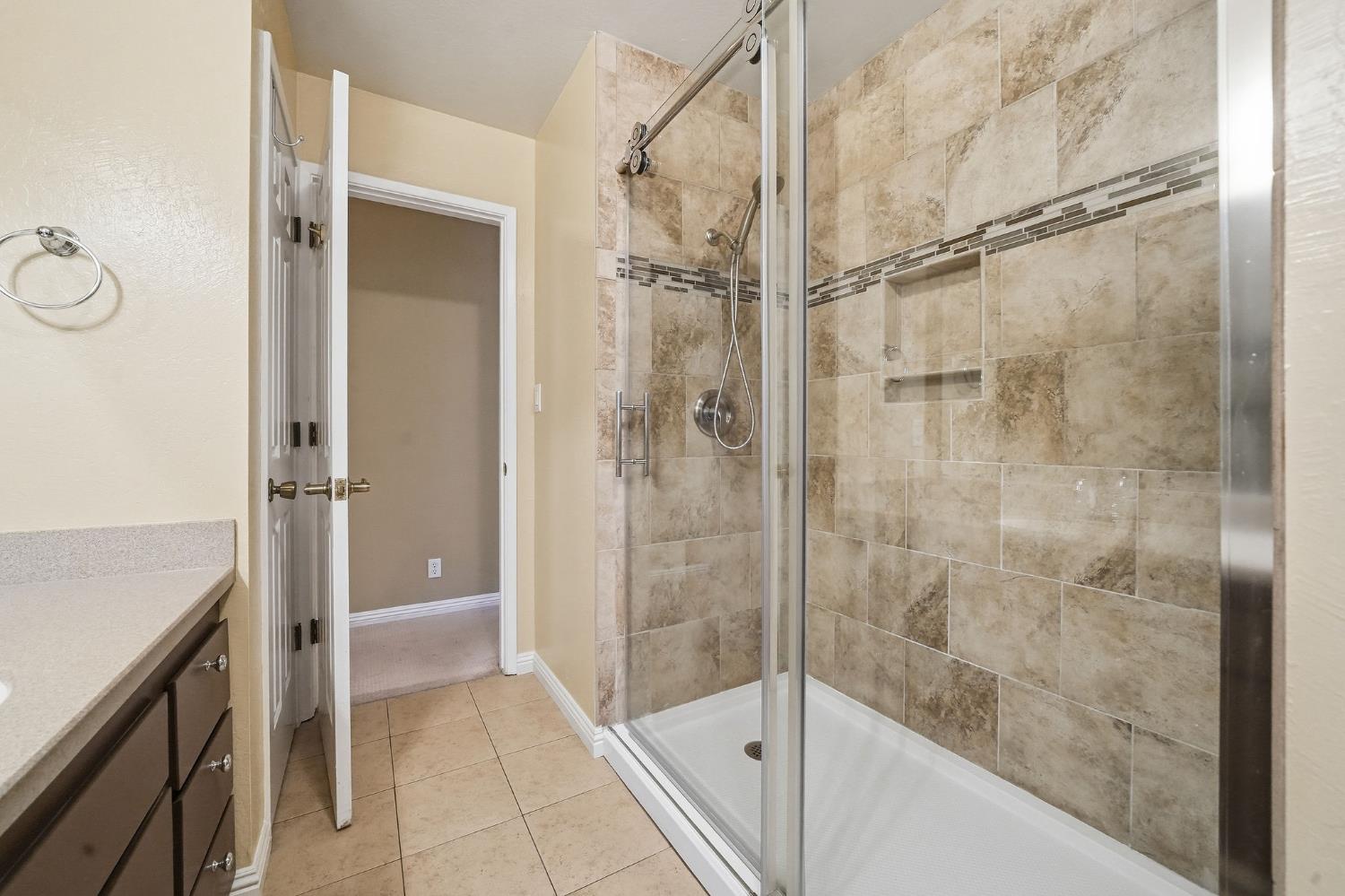 26019 Ridge Drive Pioneer, CA 95666 - Photo 45 of 75 a bathroom with a shower and a sink