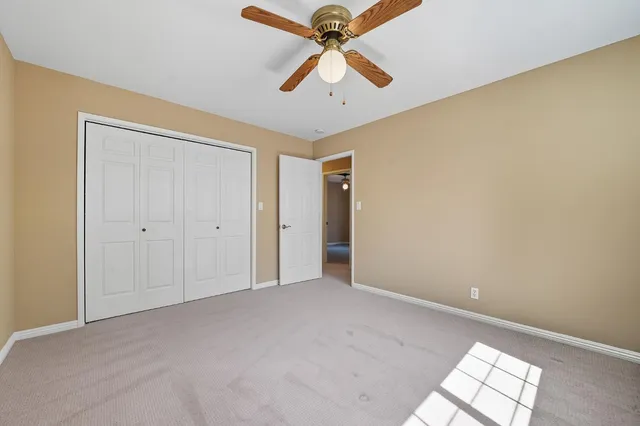 a view of a house with backyard and garden