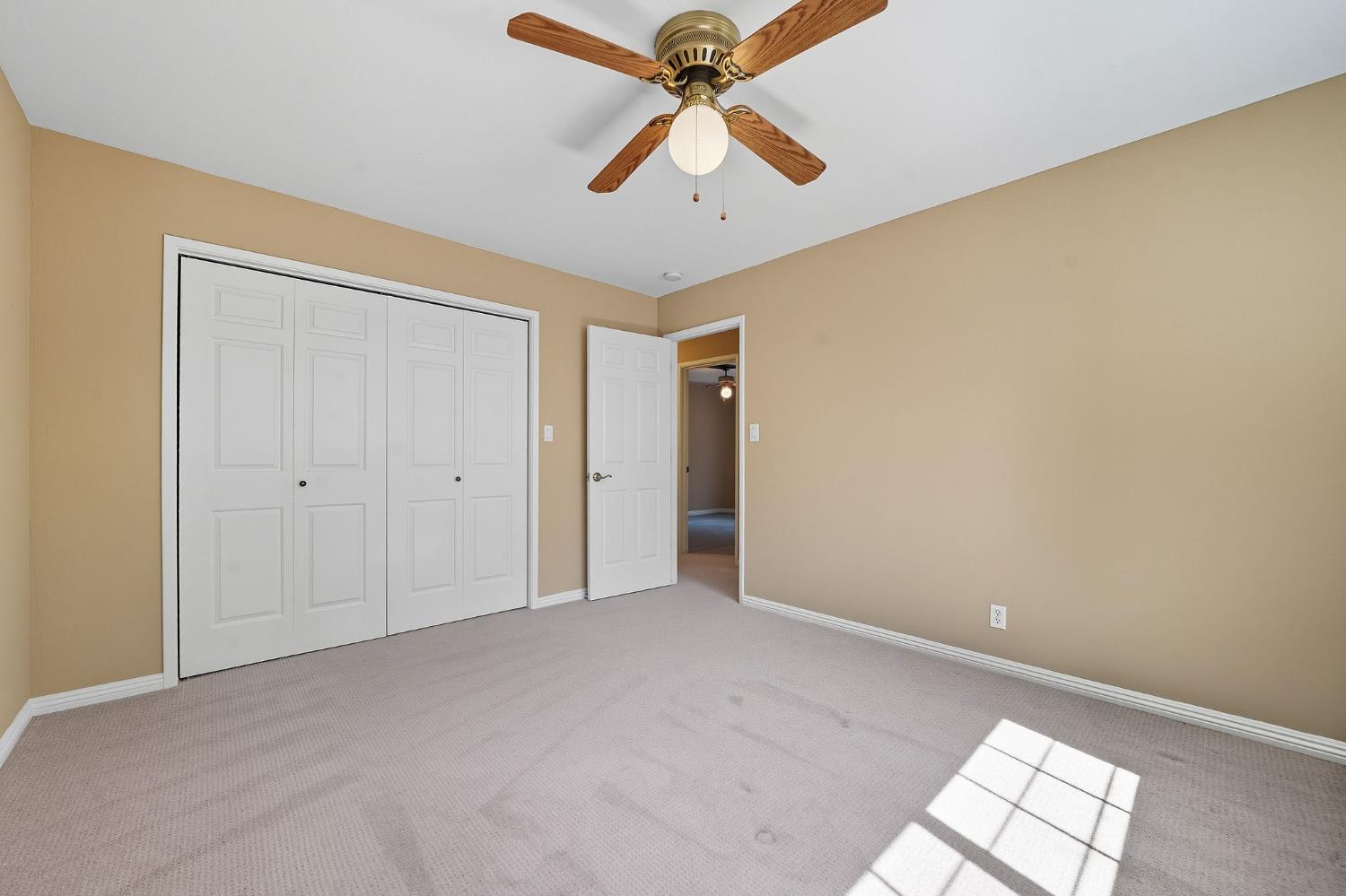 26019 Ridge Drive Pioneer, CA 95666 - Photo 47 of 75 a view of empty room with window and ceiling fan