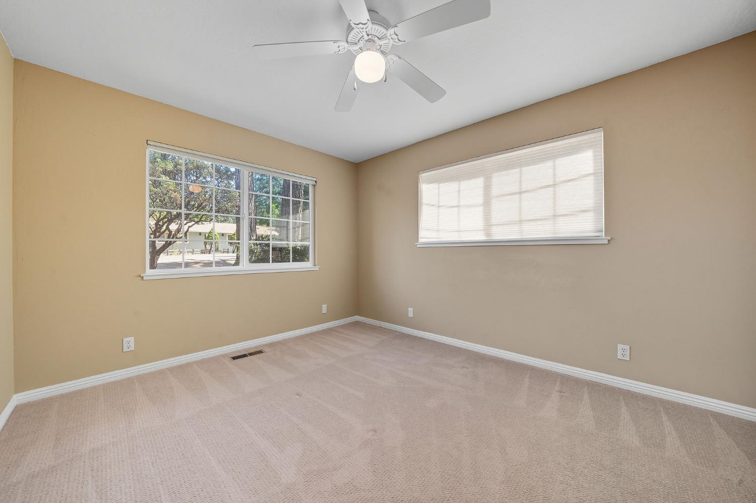 26019 Ridge Drive Pioneer, CA 95666 - Photo 48 of 75 an empty room with a window and a ceiling fan