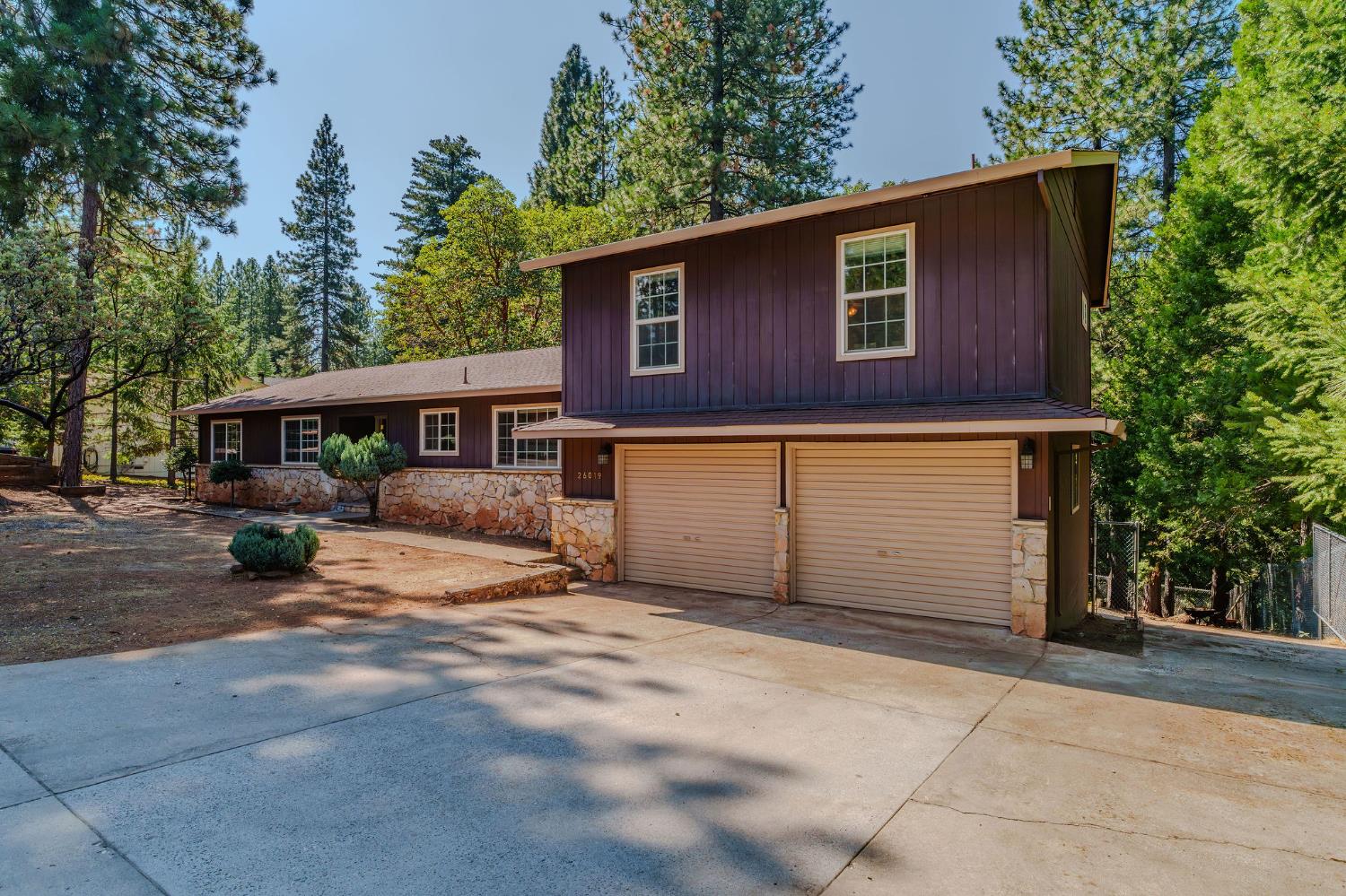 26019 Ridge Drive Pioneer, CA 95666 - Photo 63 of 75 a front view of a house with a yard and garage
