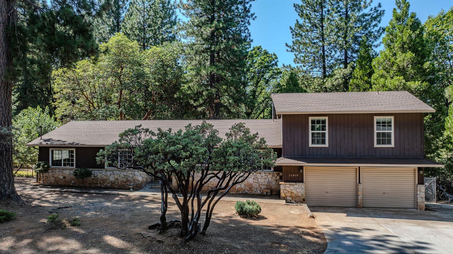 26019 Ridge Drive Pioneer, CA 95666 - Photo 70 of 75 a front view of a house with a yard and garage