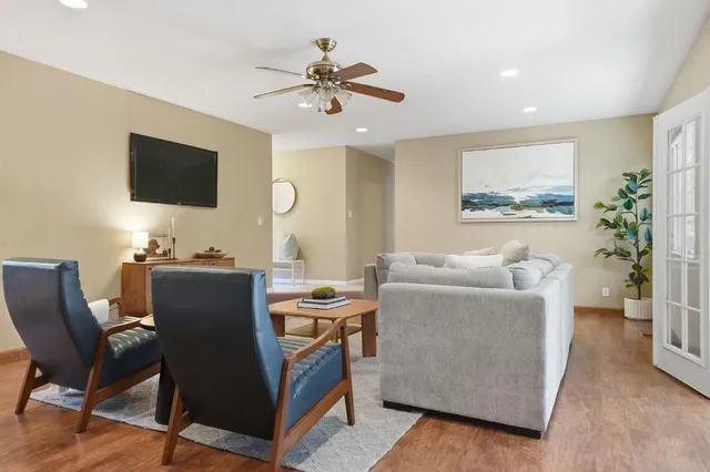 a living room with furniture and a flat screen tv