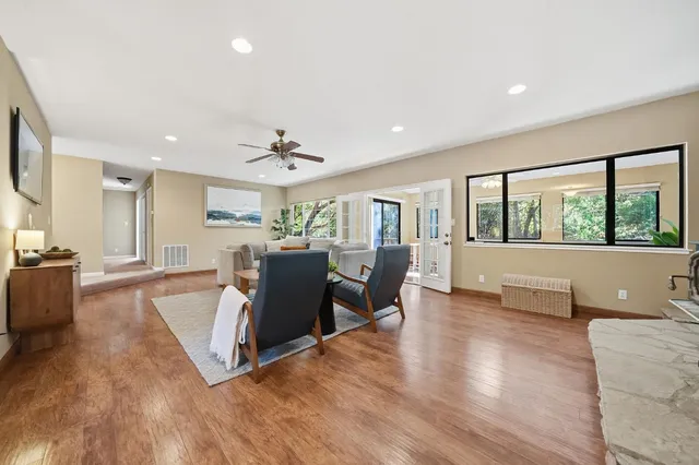 a living room with furniture and a chair