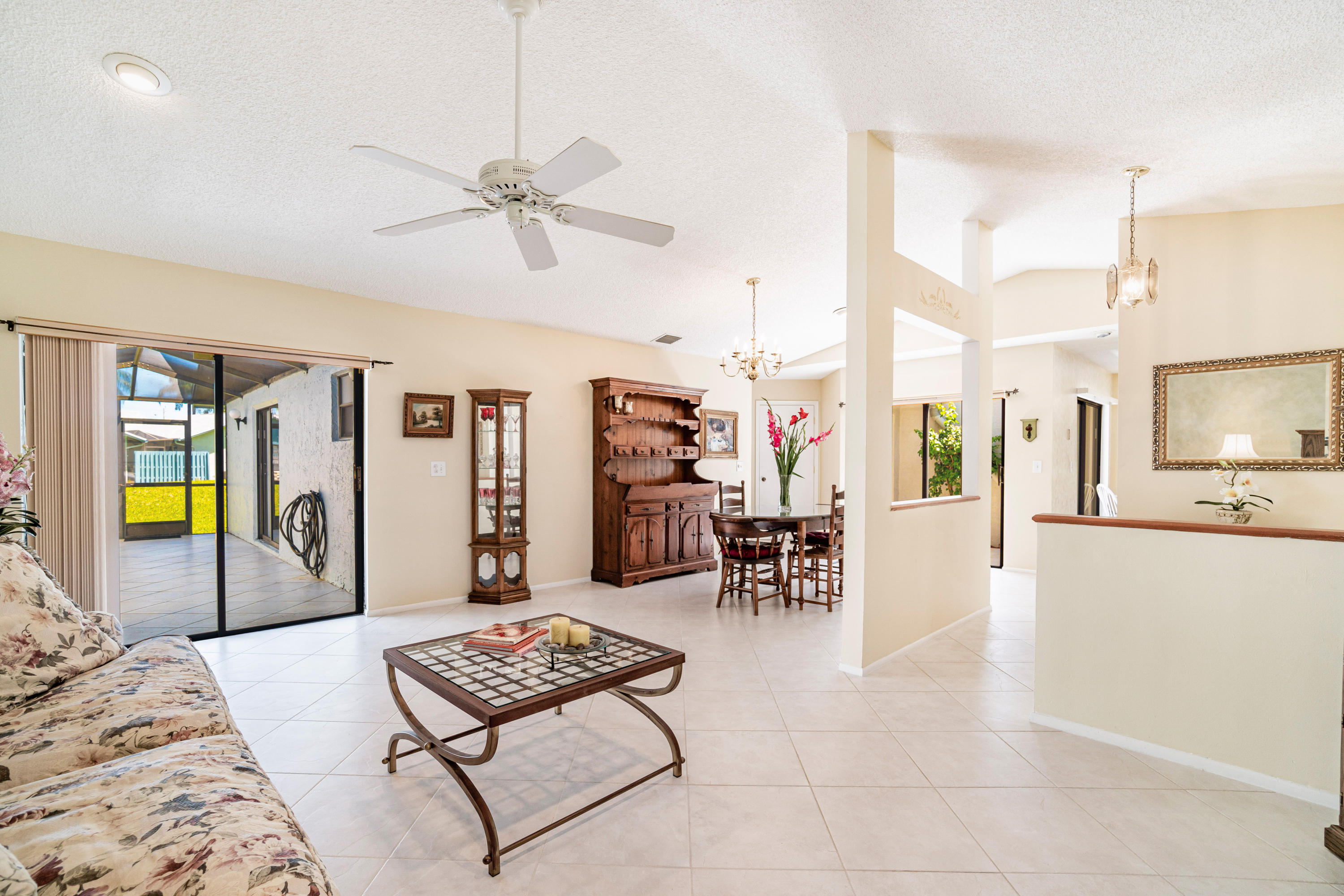 9159 Southwest 22nd Street, Unit D Boca Raton, FL 33428 - Photo 4 of 35 a living room with furniture and next to a window