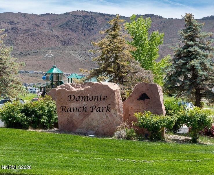 1864 Wind Ranch Road, Unit B Reno, NV 89521 - Photo 38 of 42 a sign that is sitting in front of a tree