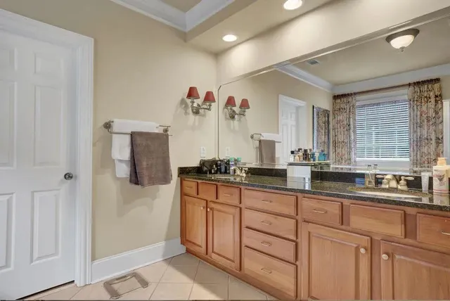 a kitchen with stainless steel appliances a sink and cabinets